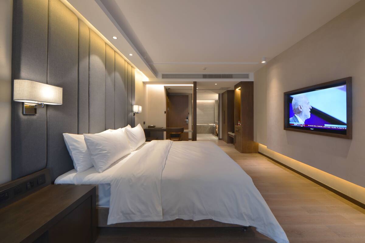 Suite Deluxe | 1 dormitorio, ropa de cama de alta calidad, minibar y caja fuerte