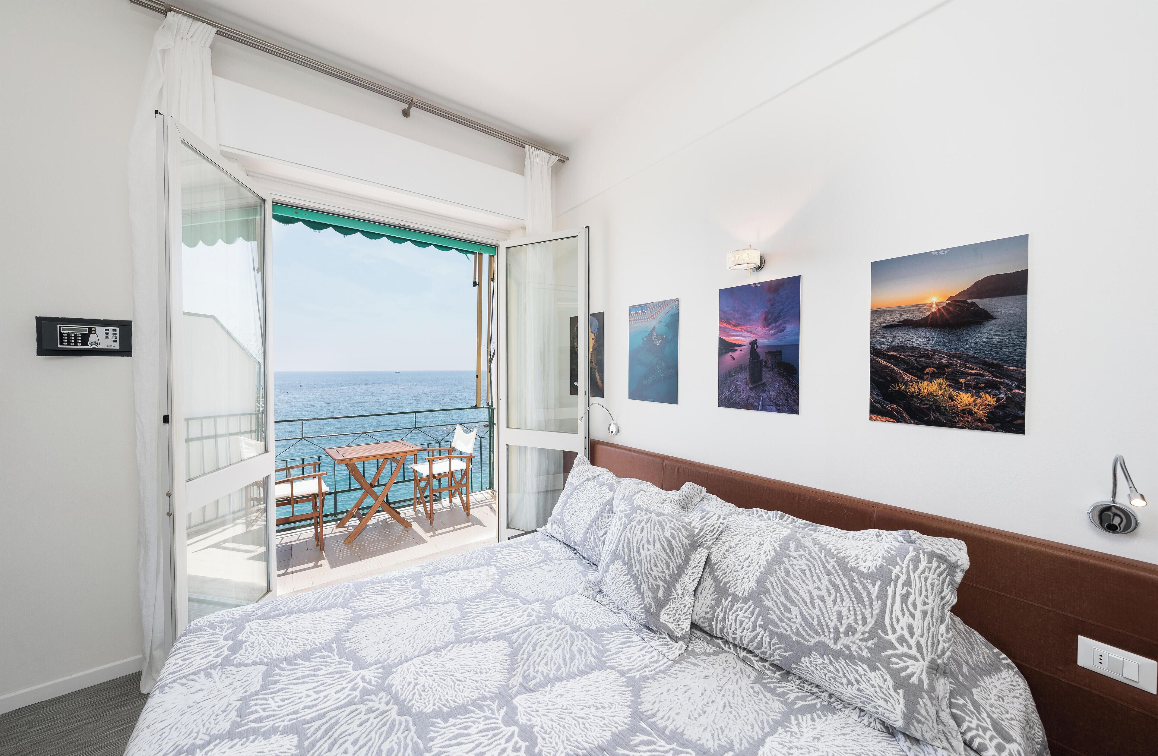 Double Room, Balcony, Sea View | In-room safe, desk, bed sheets