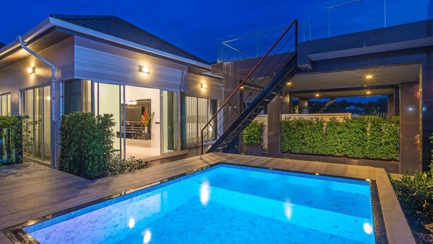 A modern house with a swimming pool, a covered patio, and a staircase leading to an upper level. - The Haven Krabi (Krabi)