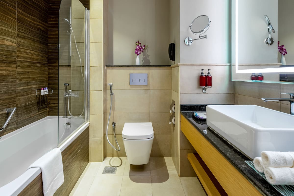 executive suite | bathroom | shower, free toiletries, hair dryer, dressing gowns