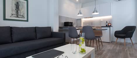 Apartment, 1 Bedroom | Living area | Flat-screen TV, DVD player