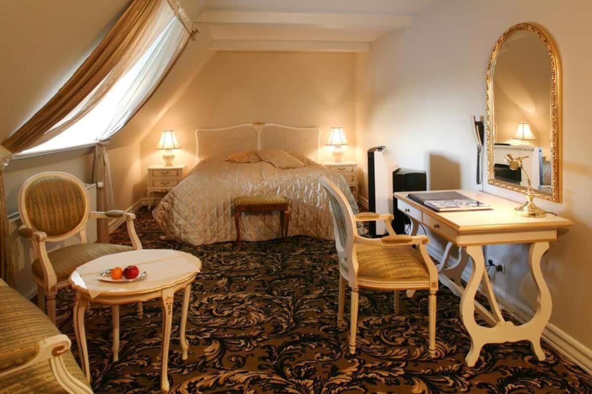 minibar, desk, blackout curtains, iron/ironing board