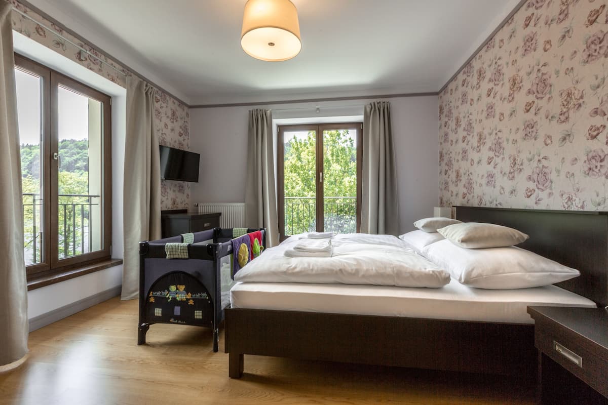 Deluxe Double Room, River View | Hypo-allergenic bedding available, in-room safe, blackout drapes