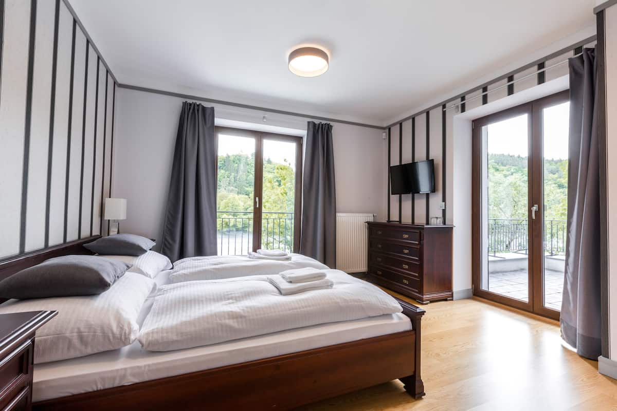 Deluxe Triple Room, 2 Bedrooms, Terrace, River View | Hypo-allergenic bedding available, in-room safe, blackout drapes