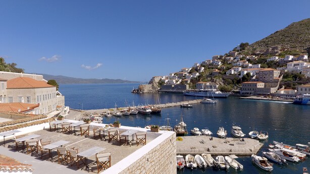 A coastal town with a marina, stone buildings, and a view of the sea. - Douskos Port House (Hydra)