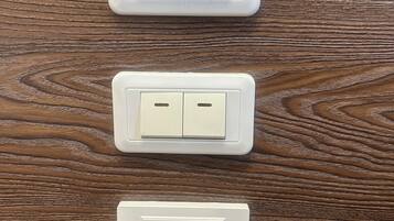 Three electrical outlets on a wooden surface.