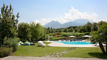 Seasonal outdoor pool, open 10:00 AM to 6:30 PM, pool umbrellas
