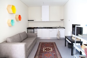 Studio Confort, 1 grand lit | Coin séjour