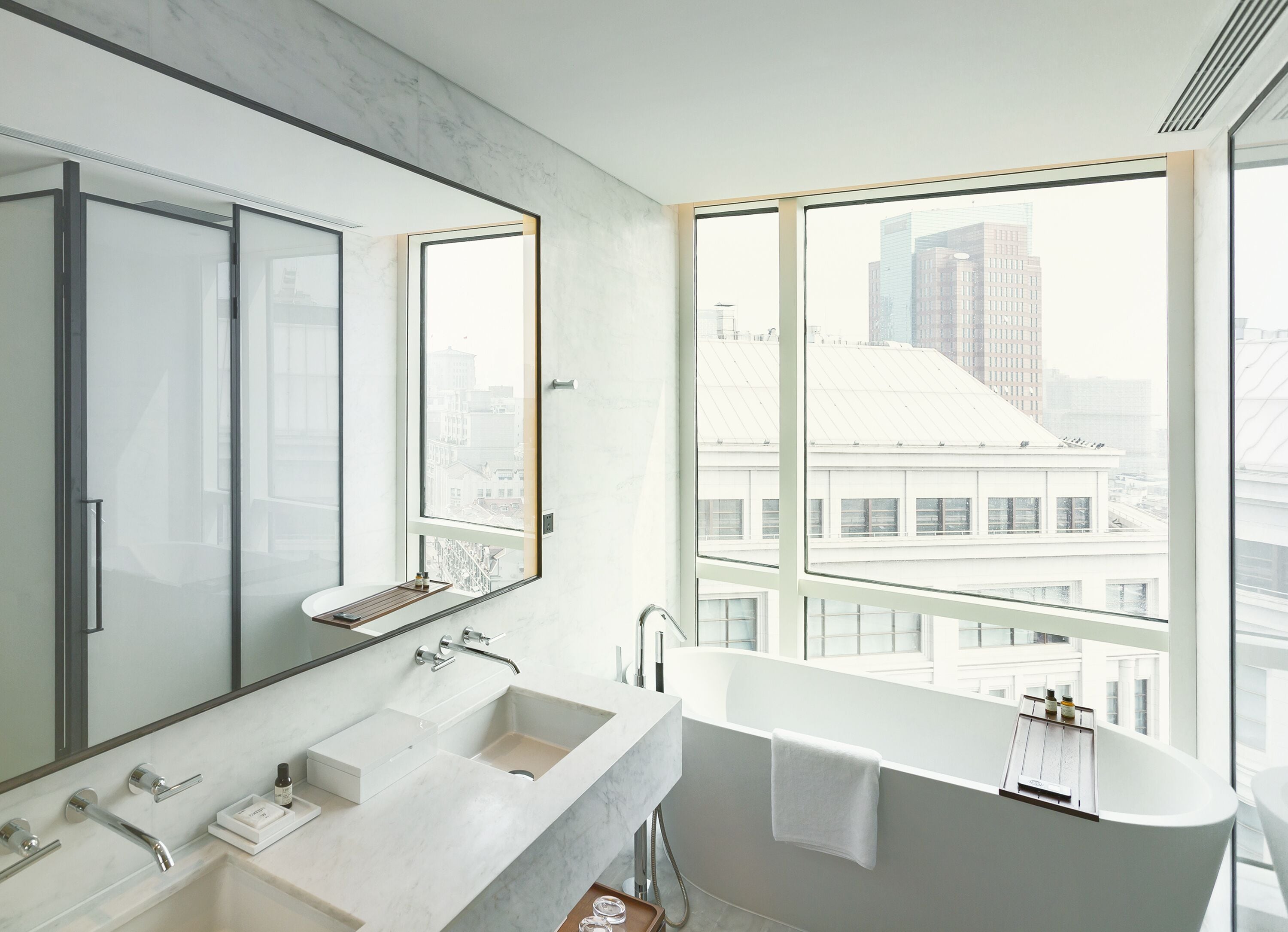 city view loft, 1 king | bathroom | separate bathtub and shower, deep-soaking bathtub, rainfall showerhead