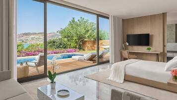 A modern bedroom with a large sliding glass door leading to a pool and garden, a flat-screen TV, and a comfortable bed.