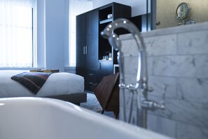 Shower, designer toiletries, hair dryer, bathrobes