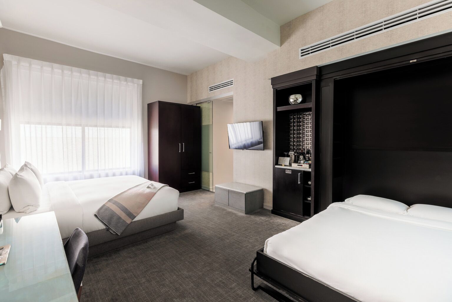 Premium bedding, down comforters, Tempur-Pedic beds, minibar