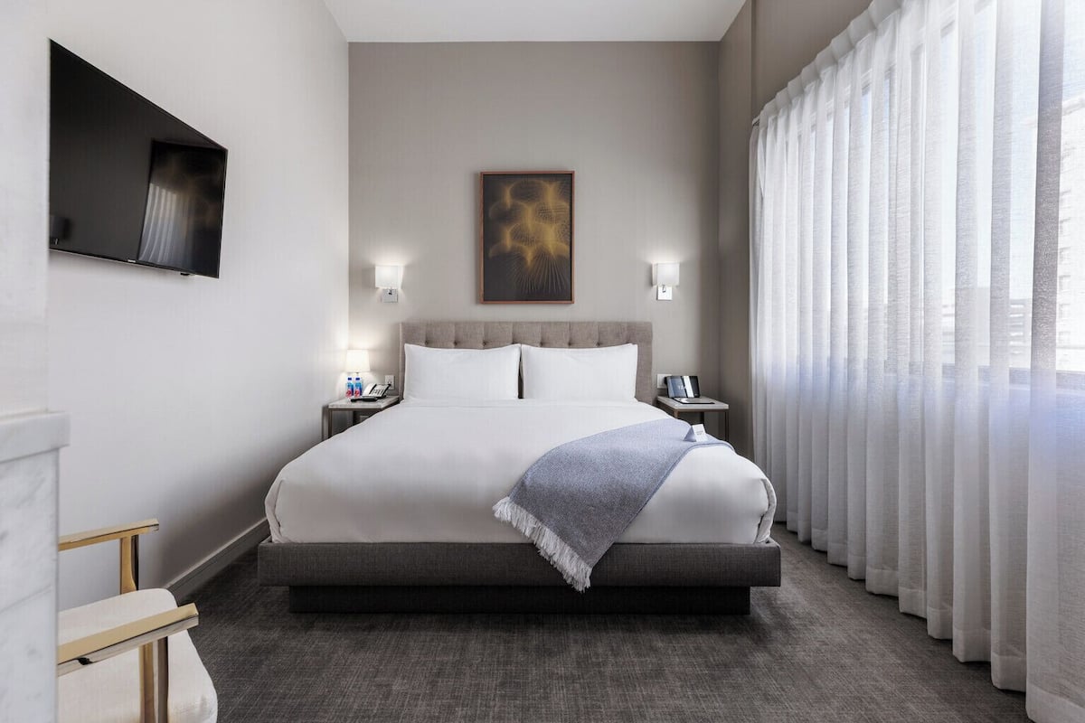 Premium bedding, down comforters, Tempur-Pedic beds, minibar