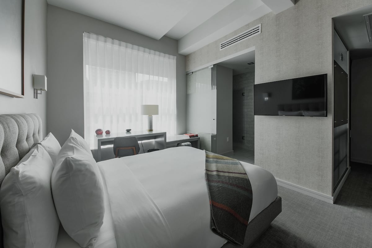 Premium bedding, down comforters, Tempur-Pedic beds, minibar