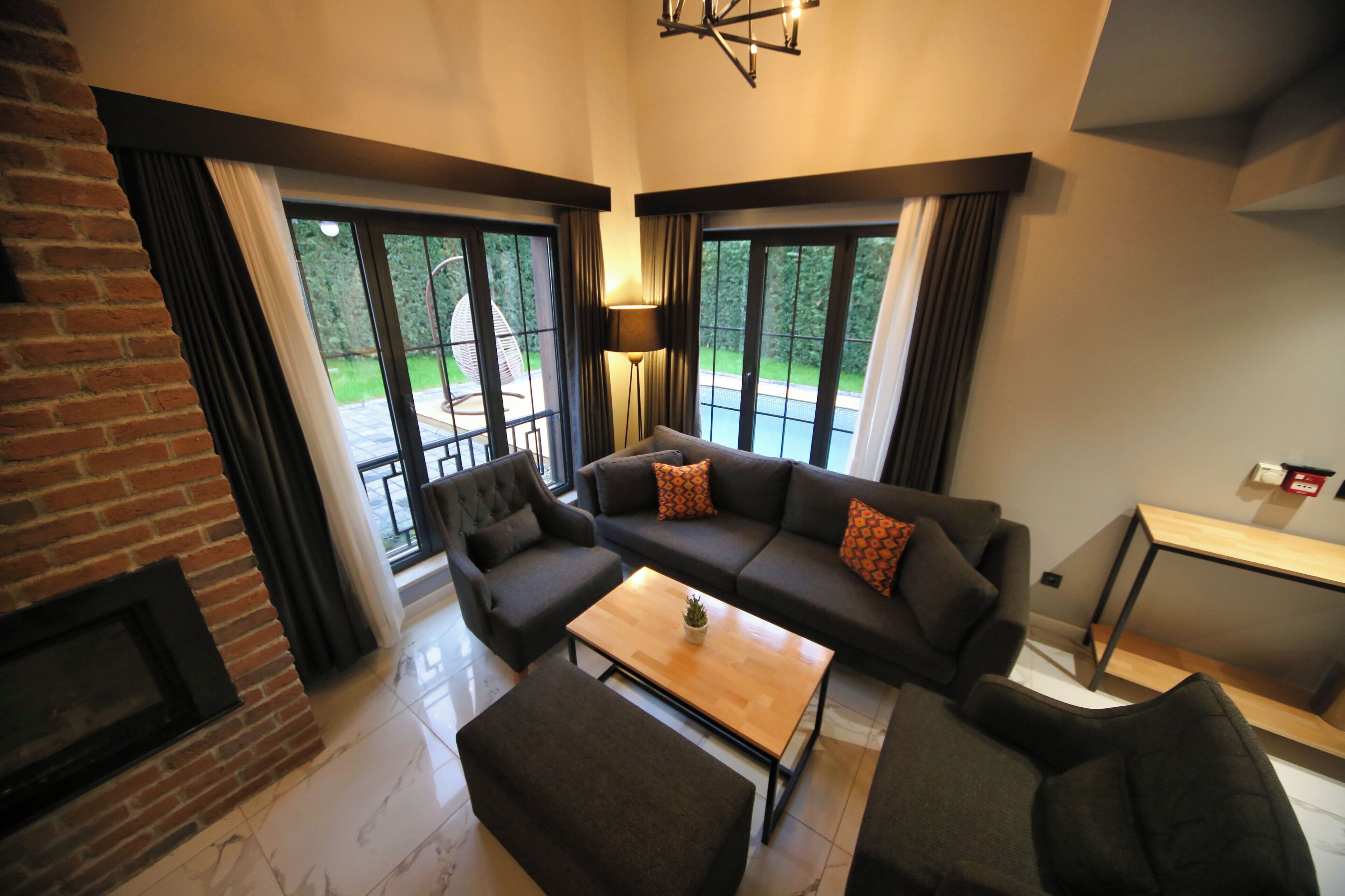 Family Duplex, Private Pool, Garden View | Living area | 75-inch LCD TV with satellite channels, heated floors