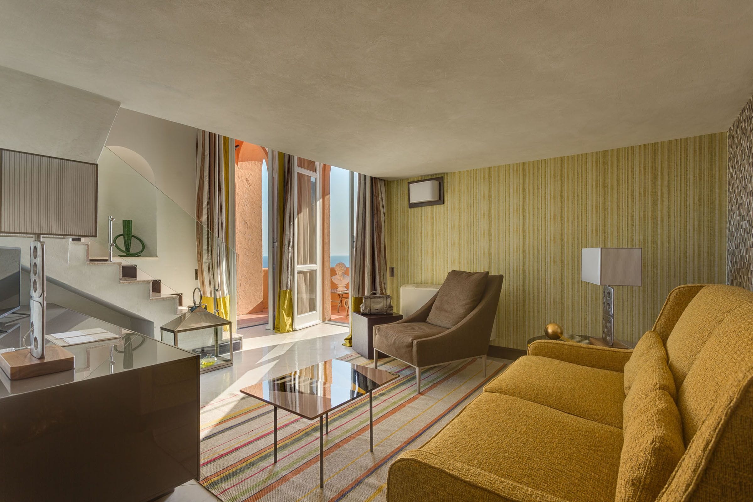 junior suite, balcony, sea view | living area | flat-screen tv