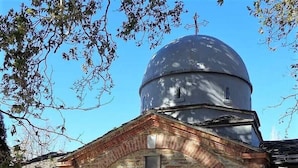 A historical building with a dome and arched entrance. - Archontiko Panagoula (Volos)
