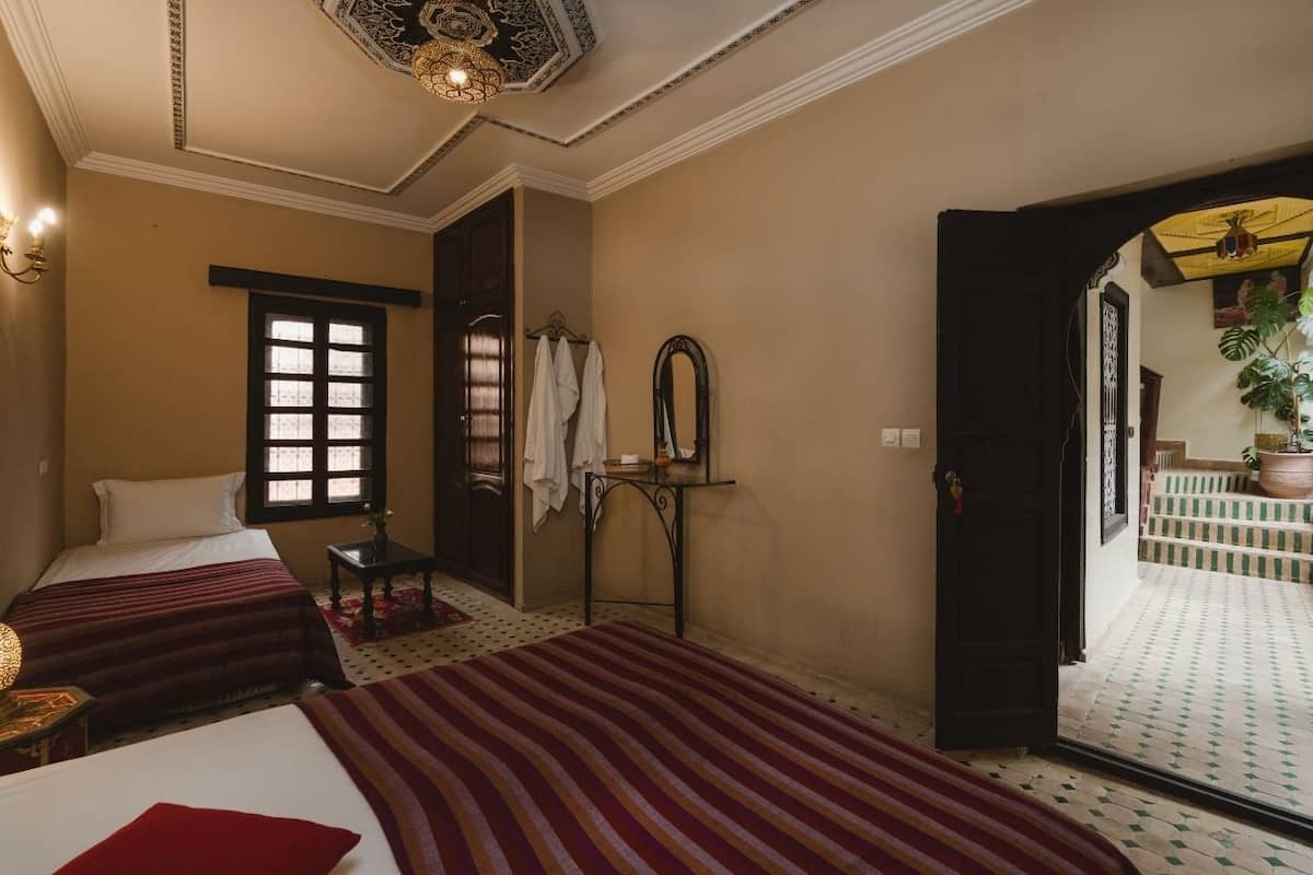 Economy Triple Room, Shared Bathroom | Blackout drapes, iron/ironing board (on request), cribs (free)