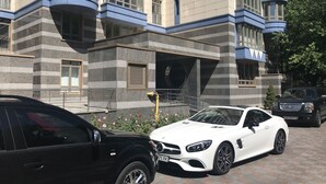 A modern building with a unique architectural design, featuring a mix of curved and angular elements. - Luxury Condominium. Kiev center. (Kyiv)