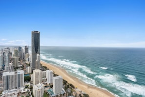 A coastal cityscape with high-rise buildings and a beach. - H'Residences - Q Stay (Surfers Paradise)