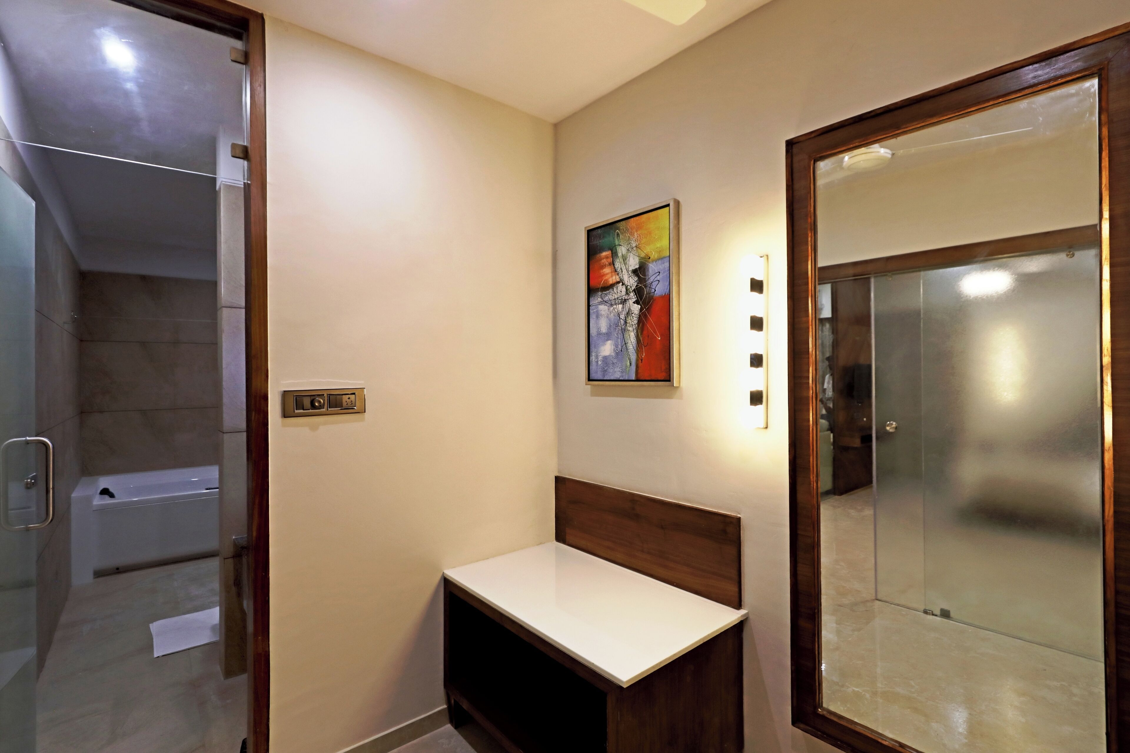 A bathroom with a shower, a toilet, and a sink.