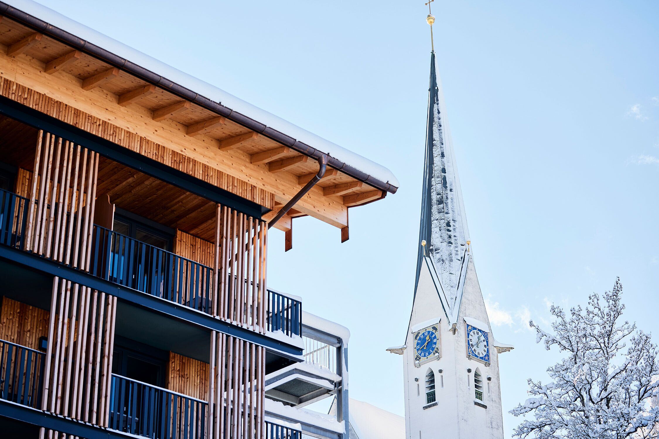 A building with a wooden facade and a clock tower.
