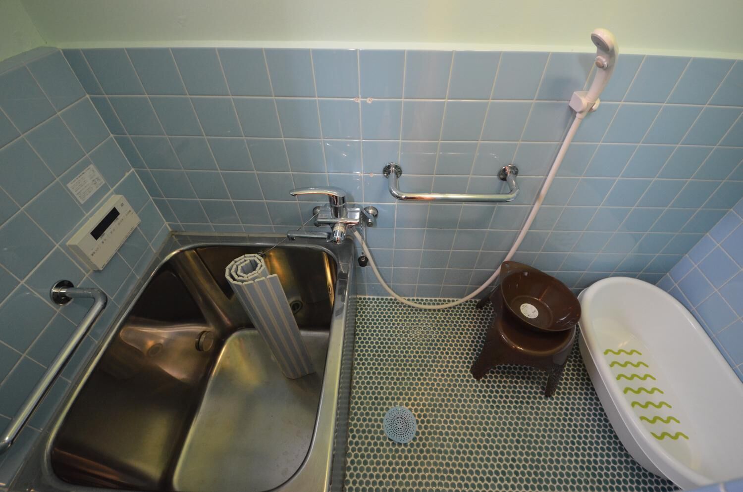 A bathroom with a sink, toilet, and shower.