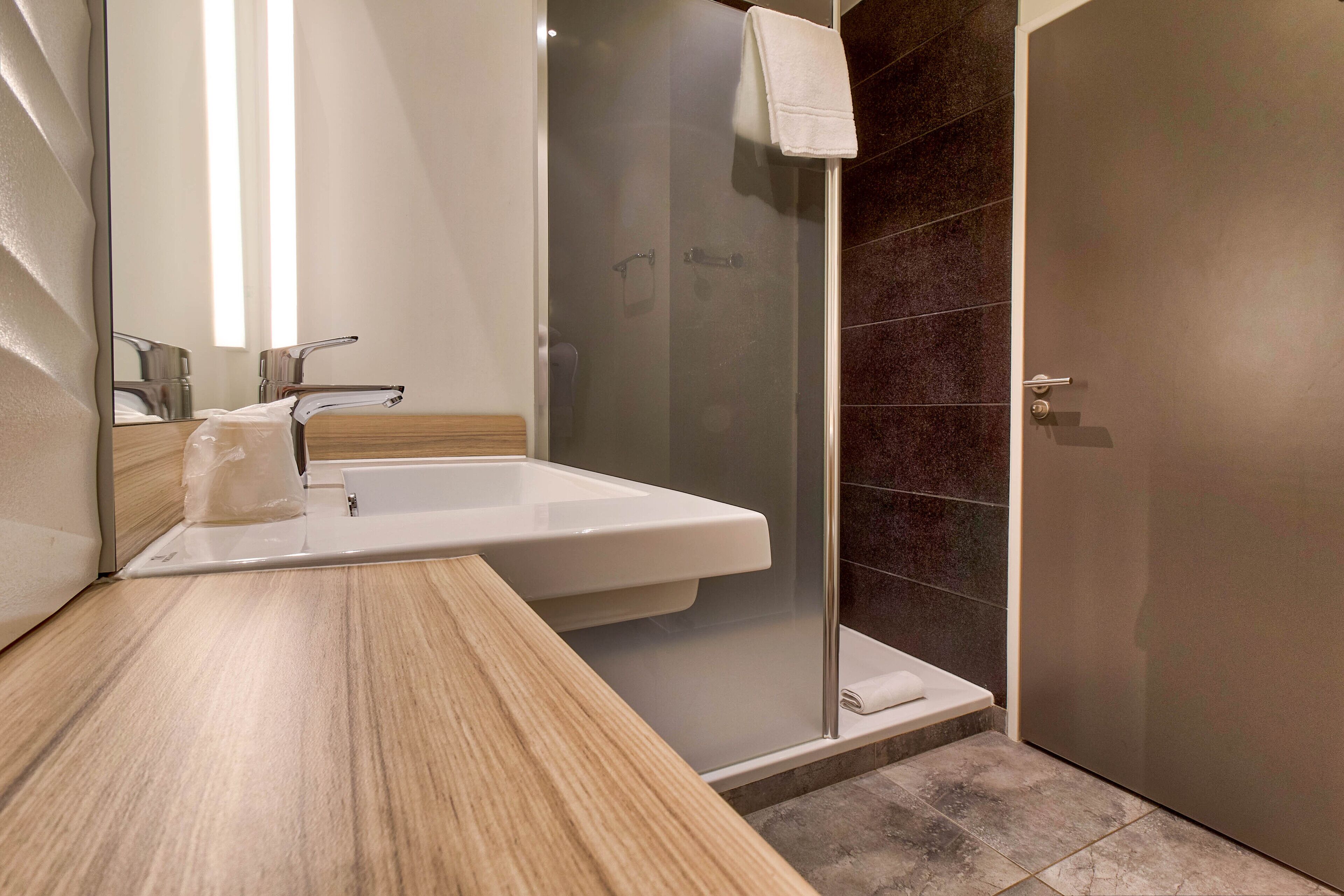 shower, eco-friendly toiletries, hair dryer, towels