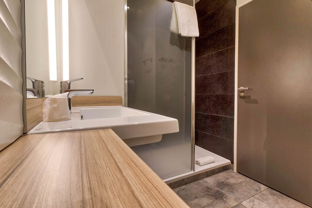 shower, eco-friendly toiletries, hair dryer, towels