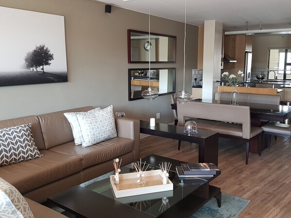 Luxury Apartment, 3 Bedrooms, Balcony | Living room | 42-cm LED TV with cable channels, TV, DVD player