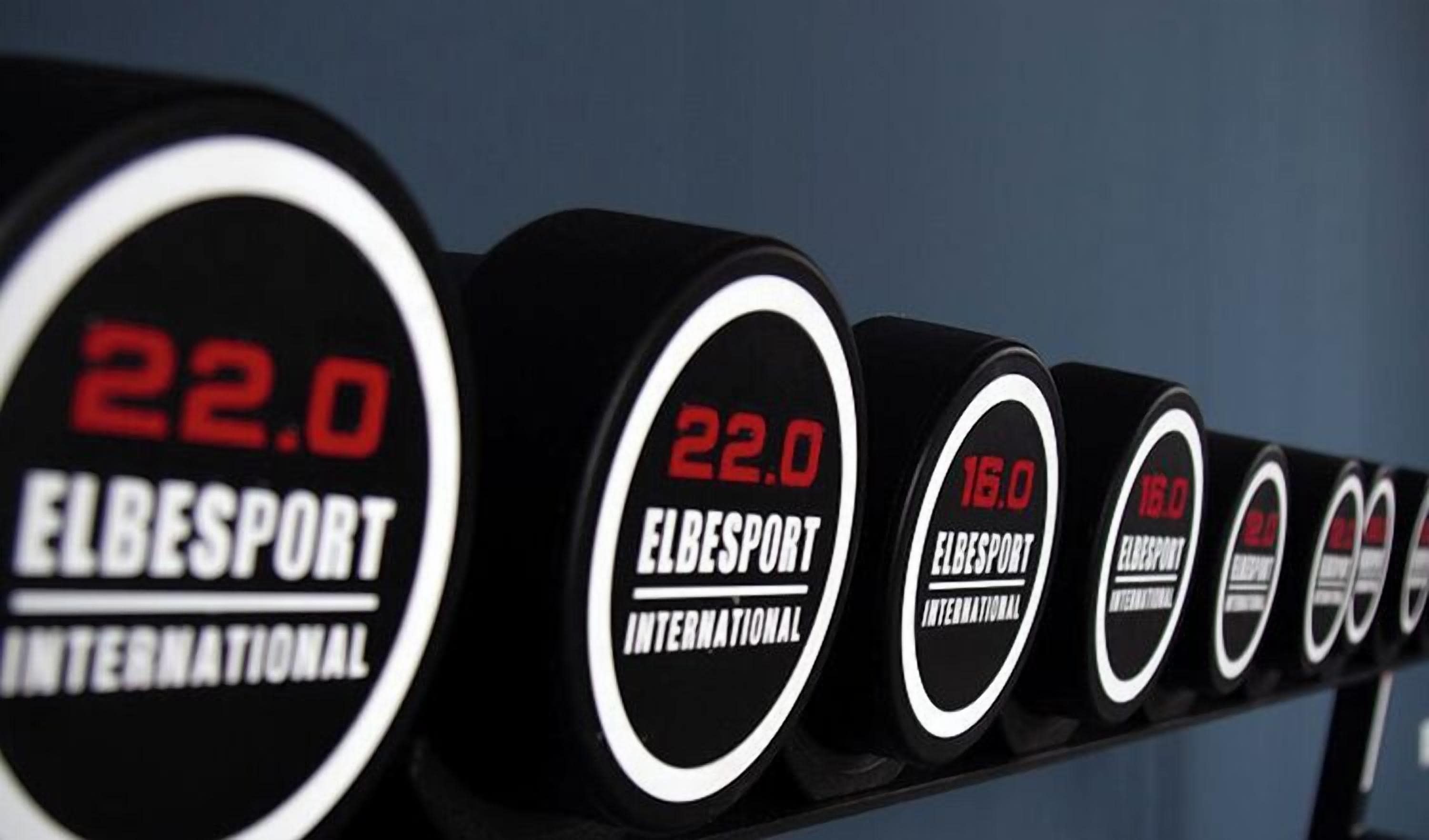 A row of circular signs with text, likely indicating a sports event or venue.