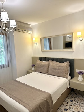 Habitación Deluxe | Minibar, decoración personalizada, wifi gratis y ropa de cama 