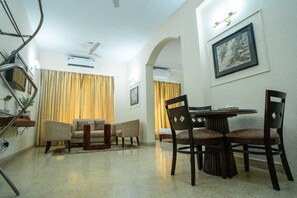 Superior Twin Apartment with Balcony | Living area | 32-inch LCD TV with premium channels, TV - Enkay Residency V Block-Cyber City (Gurugram)