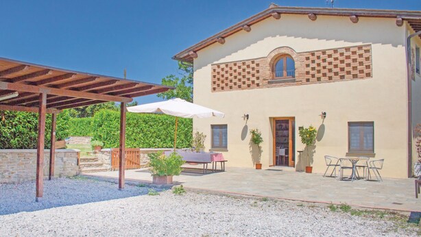 A two-story building with a patio area featuring a pergola, outdoor seating, and potted plants. - Podere Grossi (Borgo San Lorenzo)