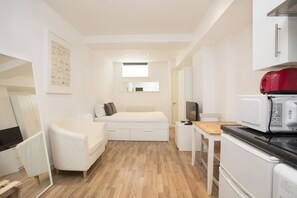 Estudio Confort | Baño | Regadera y toallas 