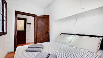 Departamento | 1 habitación, tabla de planchar con plancha, wifi gratis y ropa de cama