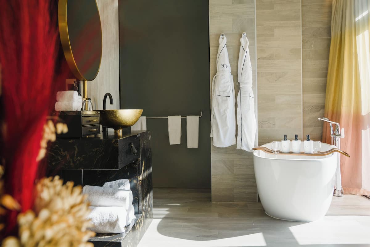 Room, 1 King Bed (Collection) | Bathroom | Separate bathtub and shower, rainfall showerhead, hair dryer, bathrobes