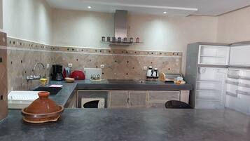 Fridge, microwave, stovetop, coffee/tea maker