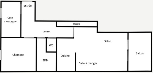 Un plan d’étage comprenant une chambre, une salle de bain, une cuisine, un coin repas et un balcon.