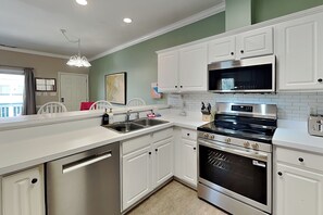 Coffee/tea maker, fridge, microwave, oven