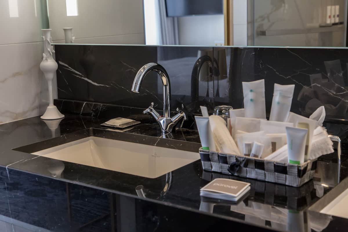 executive suite, 1 king bed with sofa bed | bathroom amenities | shower, rainfall showerhead, free toiletries, hair dryer