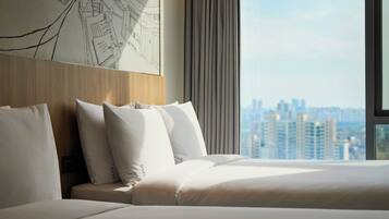 A hotel room with a large bed, a wooden headboard, and a cityscape view through the window.