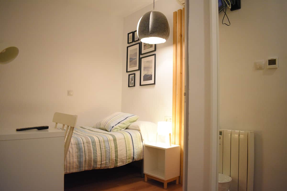 Down duvets, desk, laptop workspace, blackout curtains
