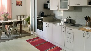 A modern kitchen with white cabinets, a microwave, a toaster, and a sink. - Very central apartment in Bilbao a few meters from Gran Vía,  E-BI-752. (Bilbao)