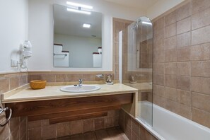 Bathtub, hair dryer, towels
