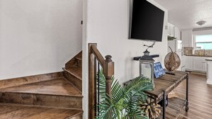 A staircase with wooden steps leading to a landing. - King size bed! Freeport Surfside Beach Bungalow Ocean & BayViews,Steps from Ocea (Surfside Beach)