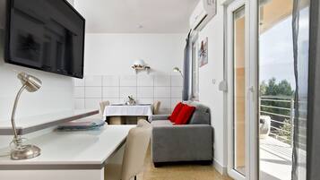 Seagull. Sea View Studio with Panoramic Balcony | Living area | LED TV