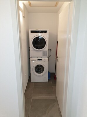 Convenient laundry facilities with a washer and dryer.