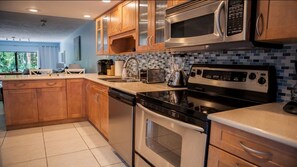 Enjoy cooking in this well-equipped kitchen with a dishwasher, microwave, toaster, and oven.