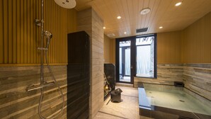 A modern bathroom with a shower, a bathtub, and a large window providing natural light. - HOTEL Cargo Shinsaibashi (Osaka)